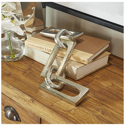 COSMOLIVING BY COSMOPOLITAN SILVER ALUMINUM CHAIN SCULPTURE, 18" X 3" X 2"