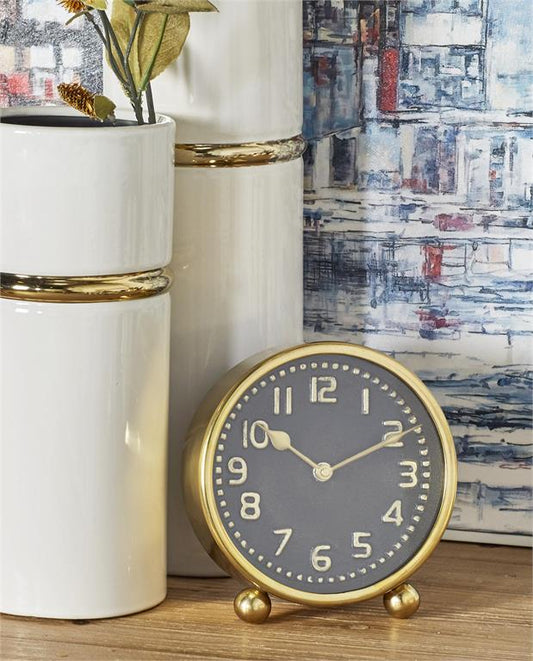 MULTI COLORED STAINLESS STEEL CLOCK WITH BLACK CLOCK FACES