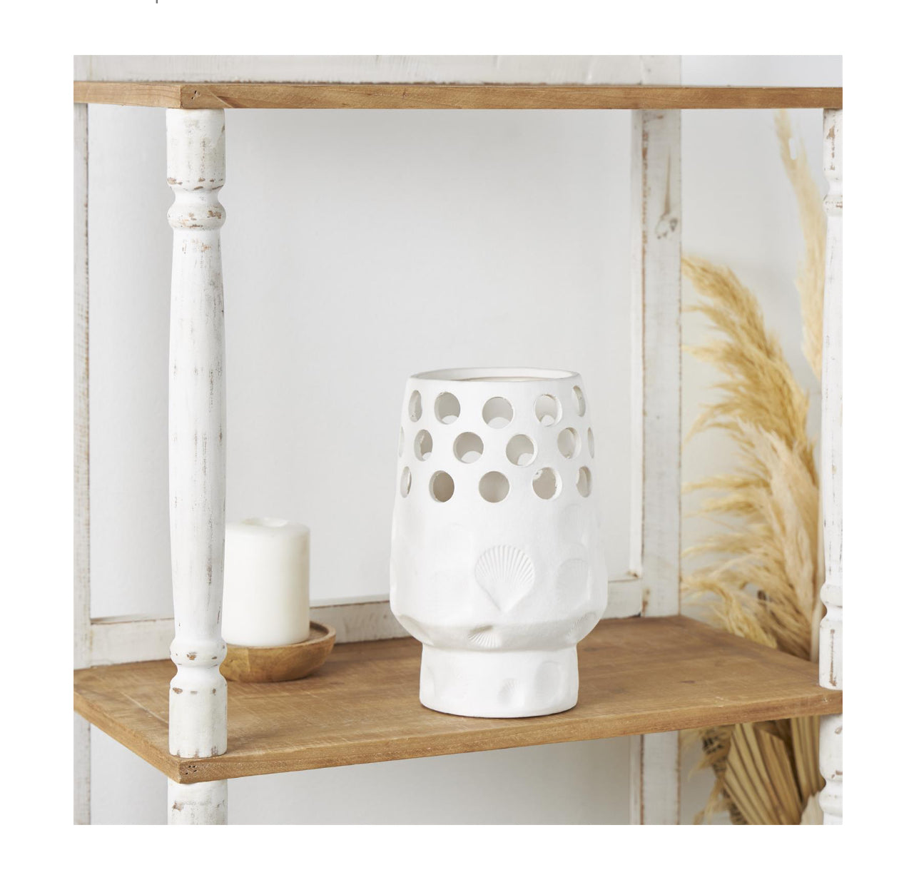 WHITE CERAMIC SHELL VASE WITH CIRCULAR CUTOUTS, 7" X 7" X 10
