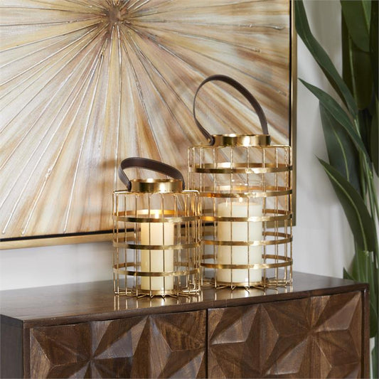 COSMOLIVING BY COSMOPOLITAN GOLD METAL PILLAR CANDLE LANTERN WITH LEATHER STRAPS